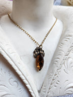 Arcane Resonance Collection – Handmade Bronze Pendant with Brown Navette Crystal