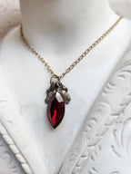 Arcane Resonance Collection – Handmade Bronze Pendant with Deep Red Navette Crystal