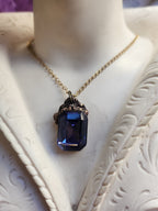 Arcane Resonance Collection – Handmade Bronze Pendant with Sapphire Blue Octagon Crystal
