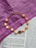 Pulsera artesanal de ópalo rosa y cobre